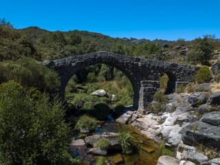 View at the Bridge of Cava da Velha or Velha bridge, a national portuguese monument, a roman bridge on Castro Laboreiro