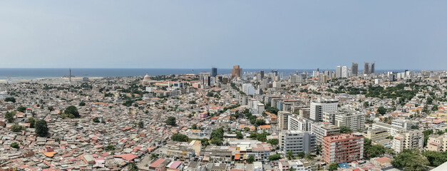 Panoramic aerial view of the full city of Luanda, Maianga, Alvalade and Mutamba, downtown and main central neighborhoods, beaches and the Atlantic Ocean