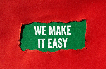 We make it easy message written on ripped torn red paper on green background. Conceptual we make it easy symbol. Copy space.