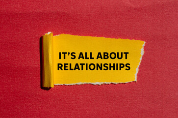 It’s all about relationships message written on ripped torn yellow paper on red background. Conceptual it’s all about relationships symbol. Copy space.