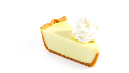 Creamy pie slice with whipped topping on a graham cracker crust