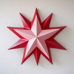 Fototapeta premium A multi point star shape red and pink on plain white background
