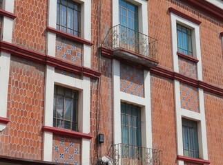 facade of a building decorated with traditional mexican tiles-talavera, Puebla