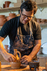 A Skilled Potter is Passionately Crafting a Unique and Beautiful Clay Vase in Their Artisan Studio