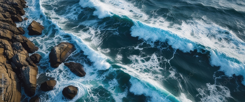 Poster aerial view of waves crashing on rocky shoreline with clear space for text or messaging