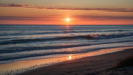 Serene Coastal Sunset Over Gentle Waves Reflecting Golden Light on Sandy Beach