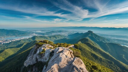 Aerial View of Scenic Hills with Rocky Outcrop and Expansive Horizon Under Clear Blue Sky Ideal for Nature Background or Text Overlay