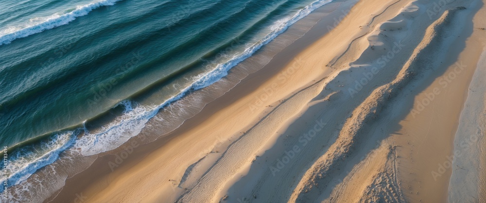 Aufkleber aerial view of tranquil sandy beach and gentle waves with space for text or design elements