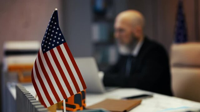 U.S. consular service employee works in office, handling foreign affairs cases