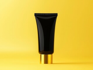 Matte black skincare tube with gold typography, minimalist packaging design, highend beauty product mockup