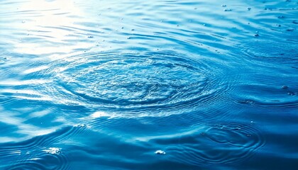 Fototapeta premium Blue ripples on the water surface. Natural, transparent and clear abstract background material of light and waves.