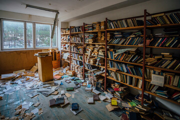Fototapeta premium Old books on shelves in cabinet of abandoned library