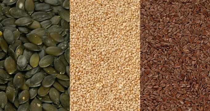 Flax, sesame and pumpkin seeds close-up footage on the rotating table.
