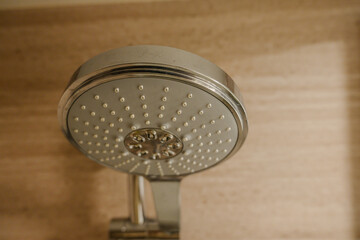 Shower head in a hotel bathroom for showering