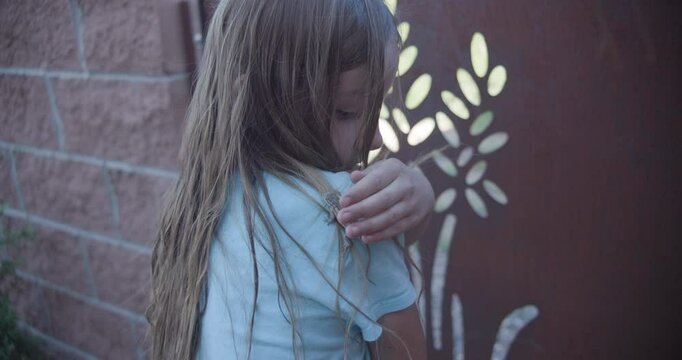 Girl Trying to Catch a Lizard and it Runs in Her Hair