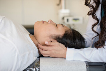 Doctor touching a trigger point on the patients neck