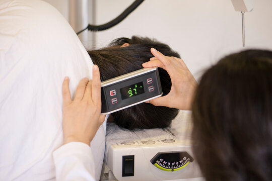 Doctor doing an atlas adjustment on patient