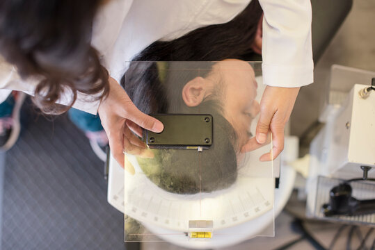 Close up of patient getting evaluated by doctor using equipment