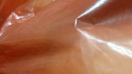 An abstract exploration of form and light, captured in the unique texture of plastic. This background offers a dynamic and intriguing visual for your designs.