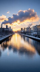 Fototapeta premium Stunning winter sunset over a tranquil river reflecting the clouds and cityscape in a serene urban setting