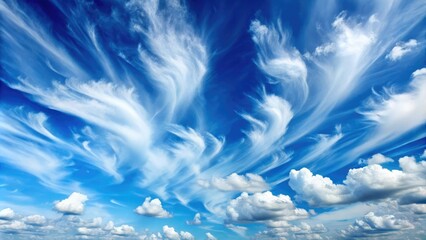 Clear summer sky with puffy white clouds and gentle wisps of cirrus against a brilliant blue background, fluffy, sky