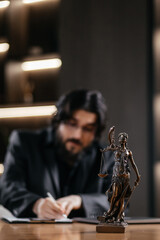 Caucasian male Lawyer holding document to read lawsuit and checking about financial business data while Protecting Client Innocents. Statute of limitations, tax and legal services firms. Vertical shot