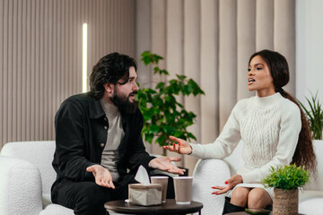 African woman talks to boyfriend about relationship problem on counseling session or couples...