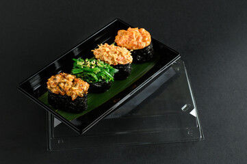 A selection of fresh sushi served on a plate, showcasing an assortment of rolls with vibrant colors and textures. The dish is perfect for an Asian restaurant menu, highlighting traditional flavors.