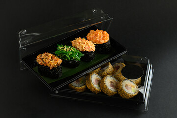 A selection of fresh sushi served on a plate, showcasing an assortment of rolls with vibrant colors and textures. The dish is perfect for an Asian restaurant menu, highlighting traditional flavors.