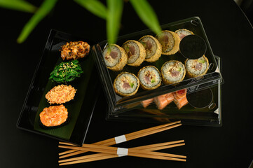 A selection of fresh sushi served on a plate, showcasing an assortment of rolls with vibrant colors and textures. The dish is perfect for an Asian restaurant menu, highlighting traditional flavors.