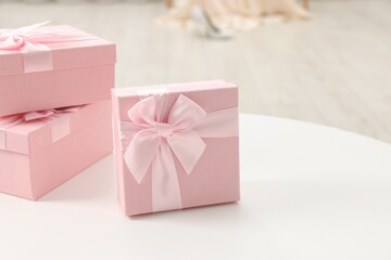 Gift boxes for wedding day on white table indoors, closeup. Space for text