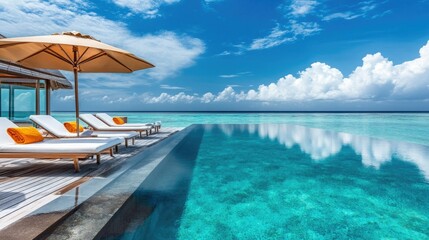 Fototapeta premium Stunning private villa with modern sun beds, a shaded umbrella, and a luxurious pool reflecting the blue sky. Peaceful paradise