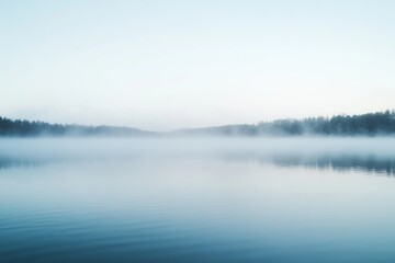 Fototapeta premium serene landscape with fog rolling over a quiet lake at dawn, evoking a demure and contemplative atmosphere, minimal background with copy space
