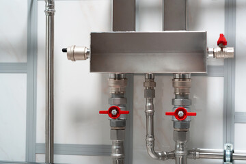 Stainless steel pipes of the heating system and water pipes in a house or apartment. Repair of plumbing heating pipes.