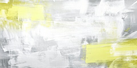 Obraz premium An abstract background featuring soft brush strokes in shades of gray and yellow with ample copy space