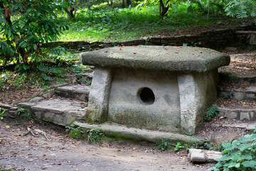 Decorative dolmen in Sochi arboretum. megalithic structure for the funeral ritual. Russia, Sochi October 10, 2024