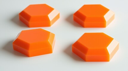 Obraz premium Set of Three Hexagonal Orange Pills on a Light Background for Creative Design and Medical Concepts