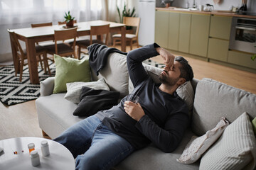 Relaxing afternoon for a handsome man enjoying a quiet moment in a cozy living space