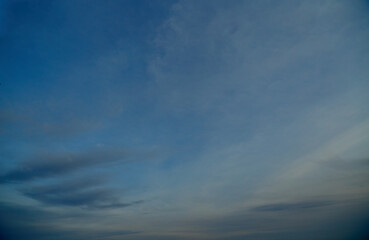 Misty sky with cirrus clouds and haze, hazy sky with clouds at sunset, sky in pastel tones with clouds.