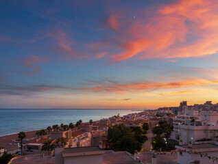 Sunset view of the city of torremolinos, Spain, and tis beaches