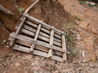 pallet boards thrown carelessly on dry land
