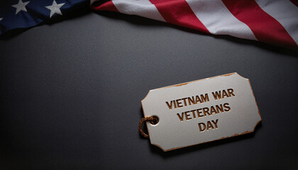 Engraved military tag displaying Vietnam War Veterans Day on black background with flag