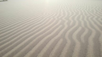 Fototapeta premium Tranquil Patterns of Soft Sand with Gentle Wave Textures