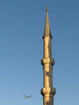 shadow of another minaret reflected on a mosque minaret