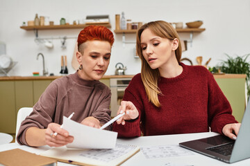 Young couple enjoying creative time together in their stylish apartment