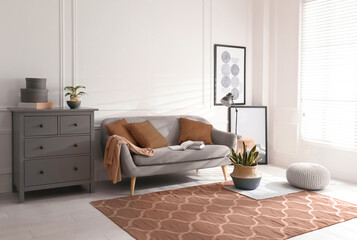 Cozy living room interior. Decorative elements in mocha mousse shade. Trendy color of 2025 year