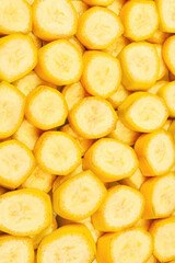 Fresh banana slices background. Top view.