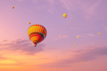 Amazing aerial view of beautiful hot air balloons at sunset in Cappadocia, Turkey