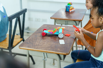 Group of diverse children enjoy learning about the STEM.