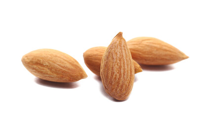Close up apricot kernels isolated on white background, side view